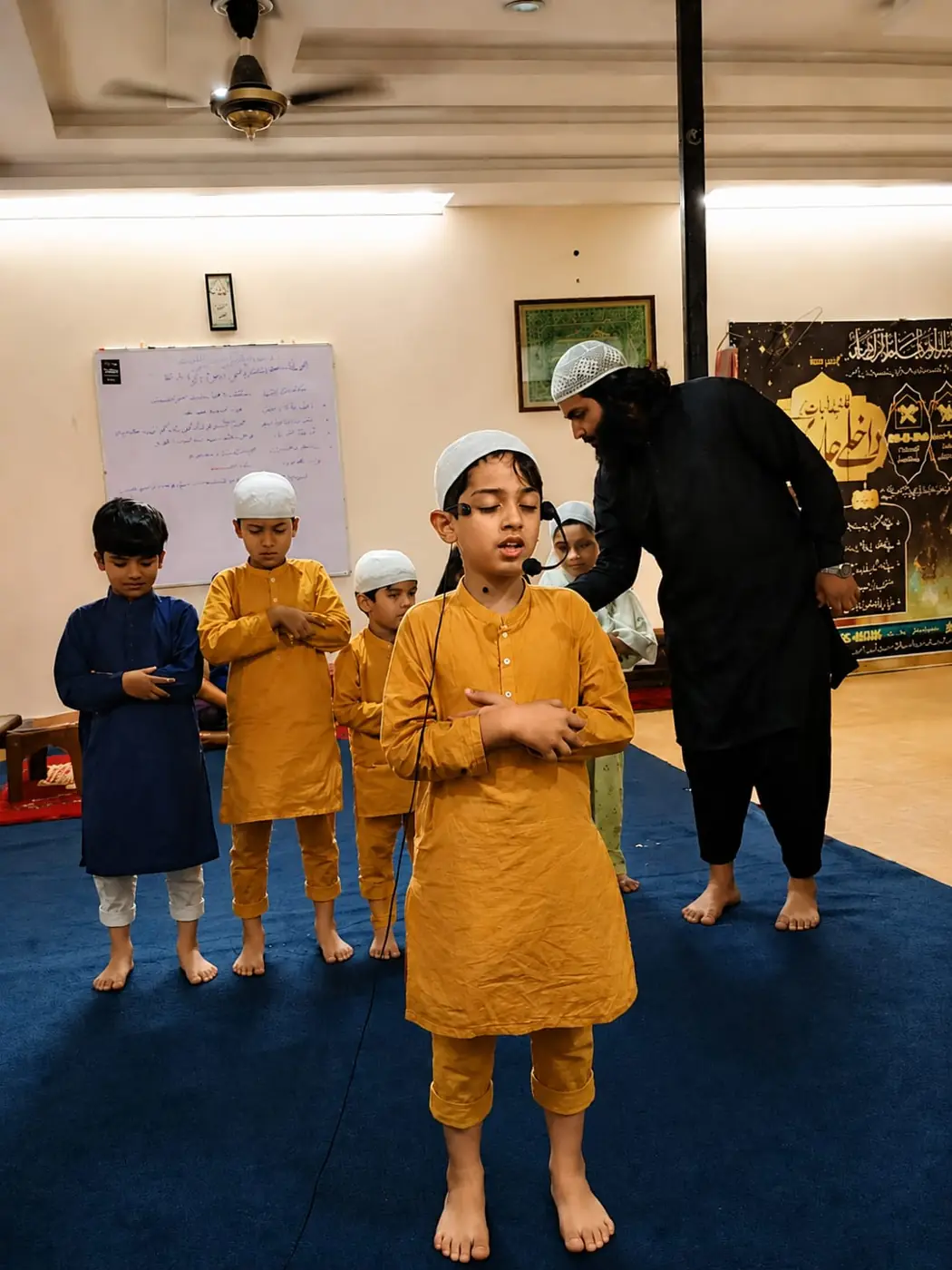 Students practising Salah with their teacher at Dar Al Isar Quran Institute, Bahria Town Lahore