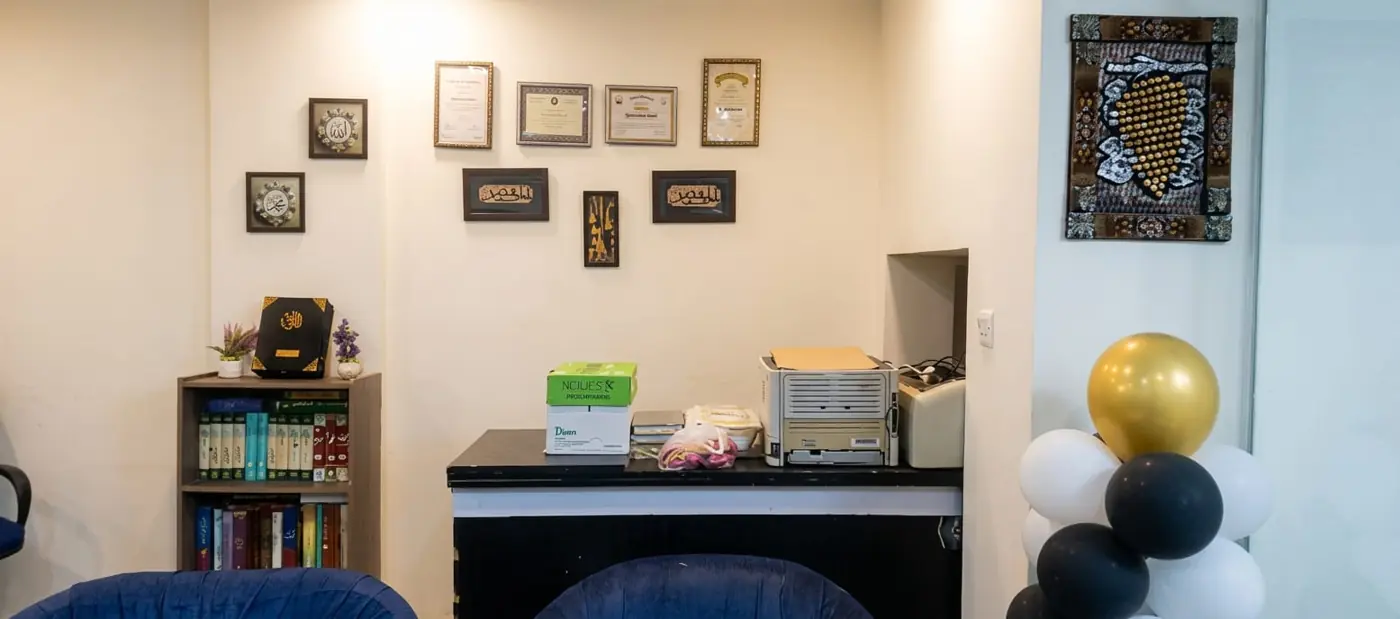 Reception with framed certificates and calligraphy